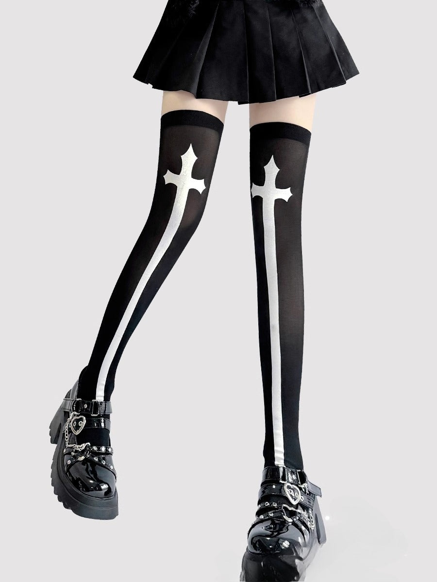 Inspired by the rebellious fusion of gothic punk and JK fashion, these thigh-high socks blend dark elegance with subcultural edge. The stark black-and-white contrast and symbolic cross motifs evoke a provocative yet sophisticated vibe. Perfect for Halloween events, cosplay, or streetwear statements, they embody a fearless expression of alternative style with a touch of daring allure.