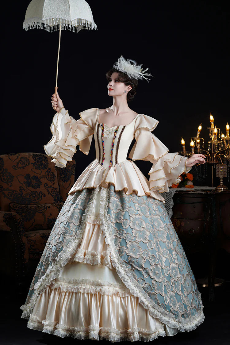 Adorn yourself in timeless elegance with this exquisite Victorian-style Lolita dress. Delicately crafted in soft blue or champagne hues, the gown features dramatic bell sleeves adorned with tiered lace frills and intricate embroidered details. The fitted bodice flows into a classic princess silhouette, embodying royal romance and sophistication. Perfect for formal events, tea parties, or photography, this piece captures the opulence of Victorian fashion with a delicate Lolita charm.