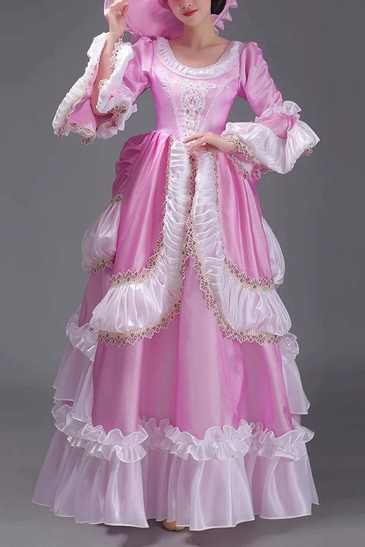 Evoking the delicate grace of a summer garden party, this dress blends timeless elegance with playful charm. The halter neckline and sleeveless design highlight feminine shoulders, while layers of lace ruffles and satin bows cascade like blooming petals. Crafted in a soft ivory-pink hue, it captures the essence of romance—inviting the wearer to step into a dream where sweetness and sophistication dance in perfect harmony.