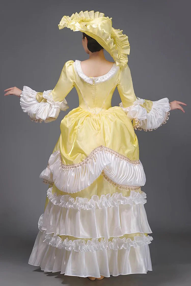 Evoking the delicate grace of a summer garden party, this dress blends timeless elegance with playful charm. The halter neckline and sleeveless design highlight feminine shoulders, while layers of lace ruffles and satin bows cascade like blooming petals. Crafted in a soft ivory-pink hue, it captures the essence of romance—inviting the wearer to step into a dream where sweetness and sophistication dance in perfect harmony.