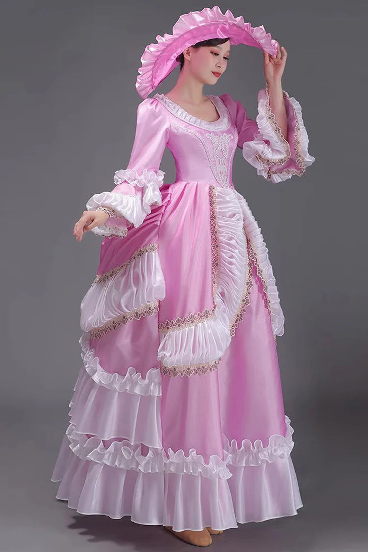 Evoking the delicate grace of a summer garden party, this dress blends timeless elegance with playful charm. The halter neckline and sleeveless design highlight feminine shoulders, while layers of lace ruffles and satin bows cascade like blooming petals. Crafted in a soft ivory-pink hue, it captures the essence of romance—inviting the wearer to step into a dream where sweetness and sophistication dance in perfect harmony.