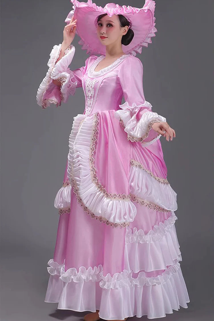 Evoking the delicate grace of a summer garden party, this dress blends timeless elegance with playful charm. The halter neckline and sleeveless design highlight feminine shoulders, while layers of lace ruffles and satin bows cascade like blooming petals. Crafted in a soft ivory-pink hue, it captures the essence of romance—inviting the wearer to step into a dream where sweetness and sophistication dance in perfect harmony.