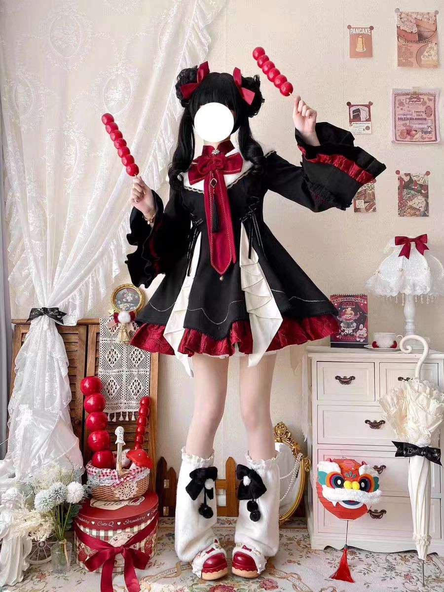 The Classic Black Red Lapel Collar Lolita Maid OP Dress captures a refined balance of elegance and playful sweetness. Its structured lapel collar, paired with charming bowknot details, highlights a delicate maid-inspired aesthetic. Long sleeves and layered ruffles enhance both comfort and volume, while the timeless black palette makes it versatile for multiple occasions. Perfect for tea parties, daily outings, or themed gatherings, this OP dress embodies classic Lolita grace with a touch of maid allure.
