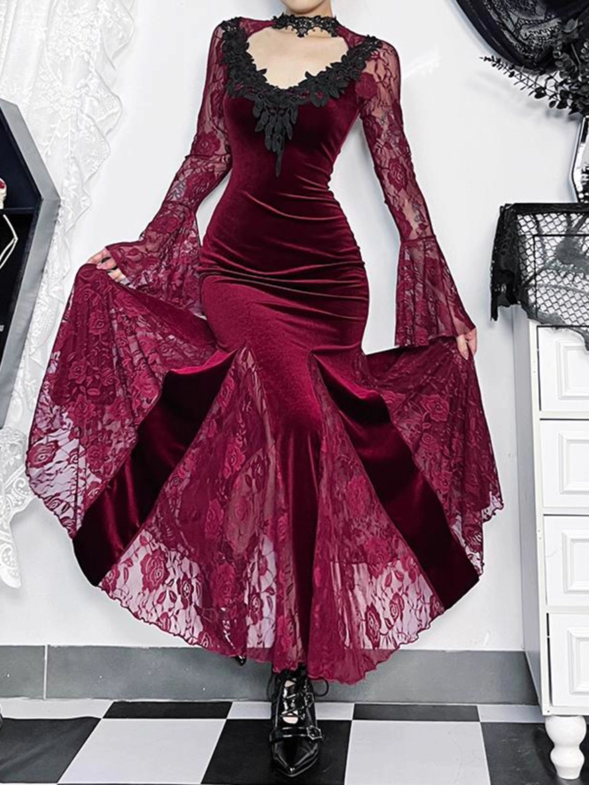 Embrace the night in this captivating vampire-inspired mermaid gown. This dress merges dark Gothic elegance with sensual sophistication, featuring a striking blood-red color scheme and intricate lace paneling. The figure-hugging mermaid silhouette accentuates your curves while the dramatic train adds royal vampiric grandeur. Perfect for Halloween parties, cosplay events, or romantic Gothic gatherings, this dress combines luxury craftsmanship with fantasy allure. Delicate lace details and a daring neckline c