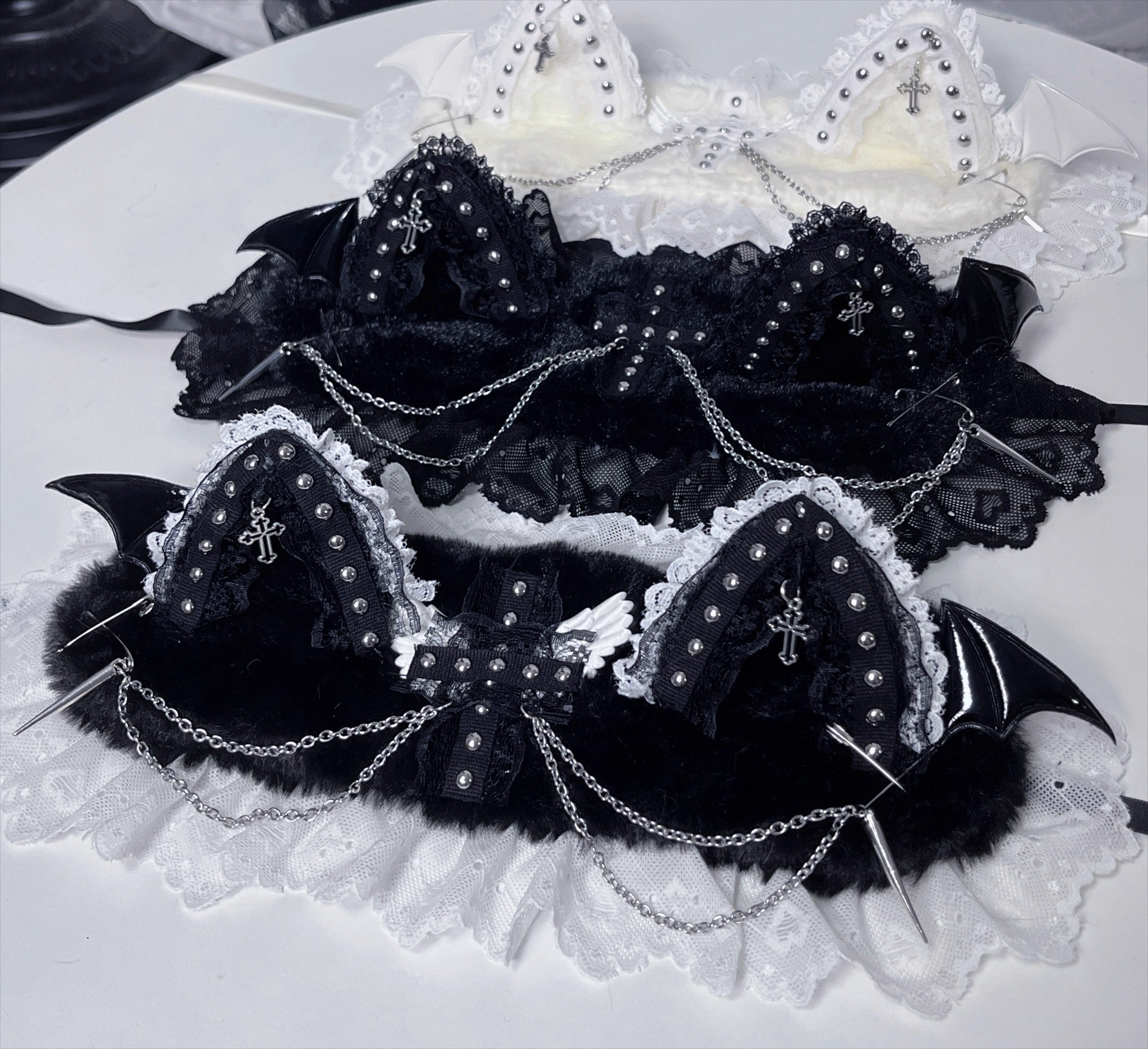 This original gothic Lolita hair clip is designed with devil cat ears and delicate lace, blending playful fantasy with dark elegance. Inspired by punk aesthetics, it combines rebellion with Lolita sweetness for a unique subculture look. Perfect for Halloween, cosplay, or alternative fashion styling, this accessory adds a bold statement to any gothic or Lolita outfit.