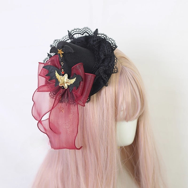 This gothic Lolita witch hat headband is crafted for a playful yet mysterious Halloween style. Designed with bat and demon elements, it combines dark fantasy with Lolita elegance. The mini top hat detail adds vintage charm, while the versatile clip design makes it easy to wear. Perfect for cosplay, themed parties, or photo shoots, it completes any enchanting outfit.