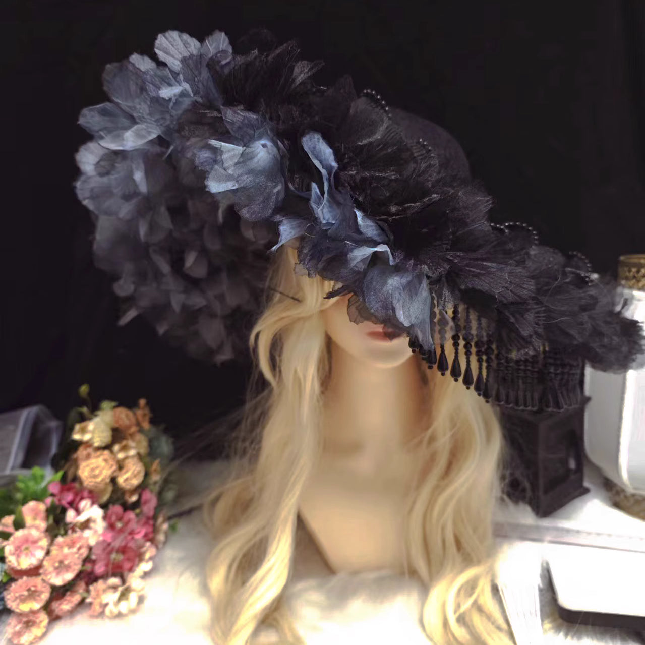 This handmade gothic Lolita widow hat embodies dark elegance with black pearls, lace, roses, and feather details. Designed for dramatic flair, it blends vintage mourning aesthetics with Lolita sophistication. The tassel accents add graceful movement, while the floral and feather elements enhance its mysterious charm. Perfect for Halloween, cosplay, or gothic fashion styling, it completes any hauntingly elegant look.