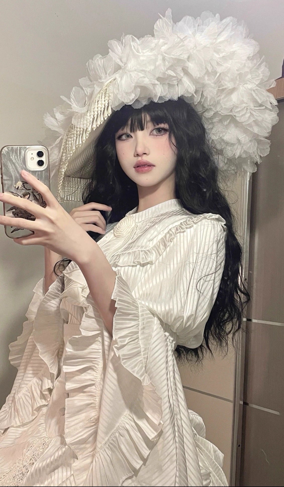 This handmade gothic Lolita widow hat embodies dark elegance with black pearls, lace, roses, and feather details. Designed for dramatic flair, it blends vintage mourning aesthetics with Lolita sophistication. The tassel accents add graceful movement, while the floral and feather elements enhance its mysterious charm. Perfect for Halloween, cosplay, or gothic fashion styling, it completes any hauntingly elegant look.