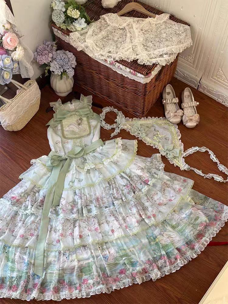 The Swan Lake Lolita JSK Dress is inspired by the elegance of ballet and the romance of fairytales. Designed with graceful lines, delicate details, and a flowing silhouette, it captures the beauty of a classic Swan Lake performance while keeping the sweet charm of Lolita fashion. Perfect for daily wear, gatherings, or special occasions, this dress blends sophistication and cuteness, making it a timeless addition to any Lolita wardrobe.