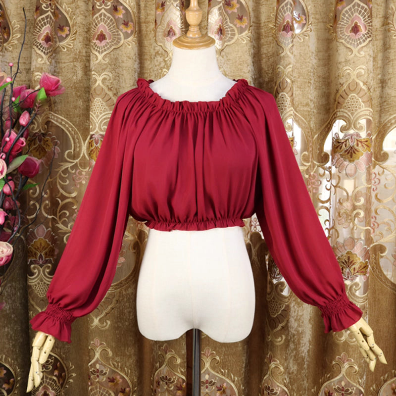 This lightweight chiffon blouse combines a classic round neck with soft puff sleeves for effortless elegance. The flowing fabric and relaxed silhouette offer versatile comfort, perfect for daily layering under jumpers or dresses. Its delicate drape and subtle sheen create a romantic foundation for both sweet and classic Lolita coordinates, blending practicality with dreamy sophistication.