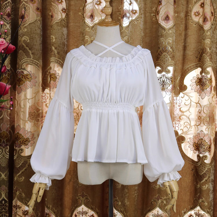 Inspired by Japanese sweet style, this airy chiffon blouse features a delicate halter neck and playful bubble sleeves. The lightweight fabric drapes softly for a dreamy silhouette, perfect for layering under sundresses or jumpers. Its whimsical design combines youthful charm with elegant details, making it ideal for creating kawaii Lolita coordinates with a touch of romantic freshness.