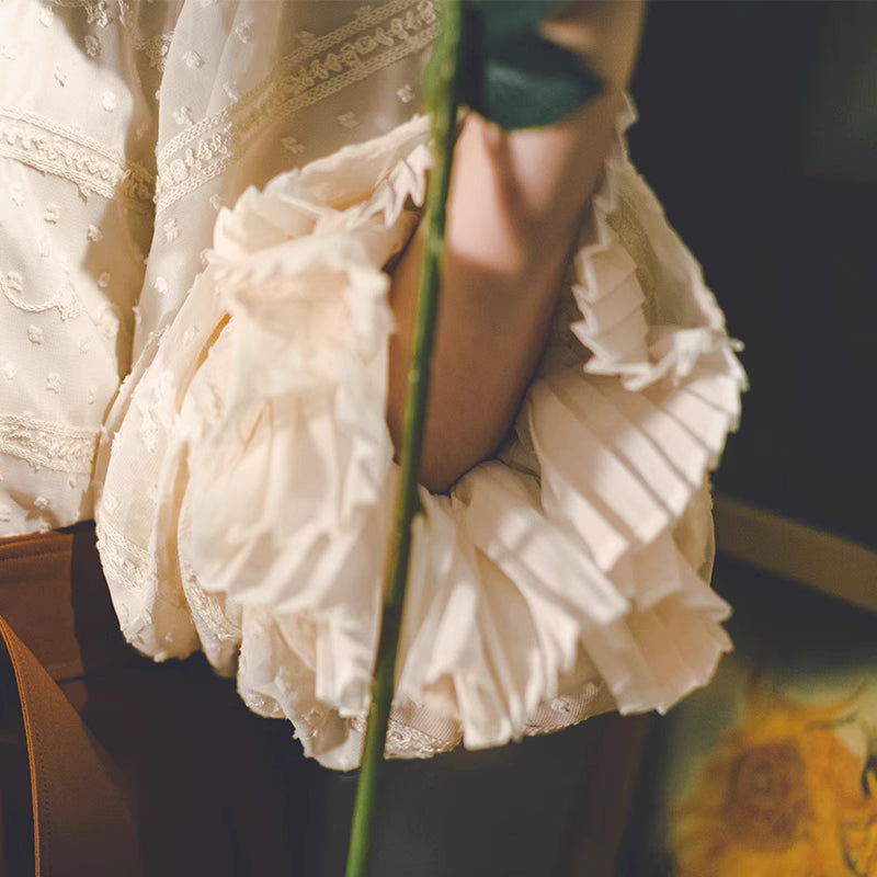 Design Concept:
This Lolita-style blouse in light apricot captures the elegance of Victorian fashion with its refined lantern sleeves and graceful double-layered design. Crafted from soft, breathable fabric, it offers both comfort and sophistication. The delicate tailoring highlights a timeless charm, making it perfect for pairing with skirts, jumpers, or corsets. Suitable for daily wear, casual outings, or elegant gatherings, this blouse adds a touch of classic romance to any Lolita wardrobe.