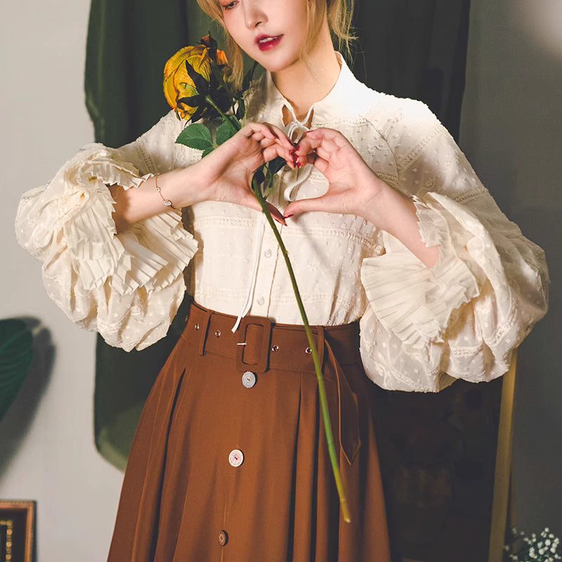 Design Concept:
This Lolita-style blouse in light apricot captures the elegance of Victorian fashion with its refined lantern sleeves and graceful double-layered design. Crafted from soft, breathable fabric, it offers both comfort and sophistication. The delicate tailoring highlights a timeless charm, making it perfect for pairing with skirts, jumpers, or corsets. Suitable for daily wear, casual outings, or elegant gatherings, this blouse adds a touch of classic romance to any Lolita wardrobe.