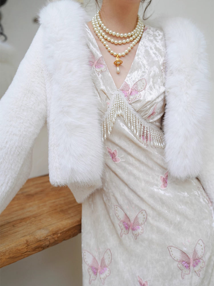 Inspired by the ethereal texture of cloud mousse, this wrap embodies luxurious comfort. Crafted from incredibly soft, plush faux mink fur, it offers a guilt-free, vegan-friendly opulence. The pure white hue and elegant shawl collar design evoke timeless French elegance. Lightweight yet cozy, it's the perfect statement piece for effortless style and sublime warmth, blending ethical fashion with a touch of romantic sophistication.
