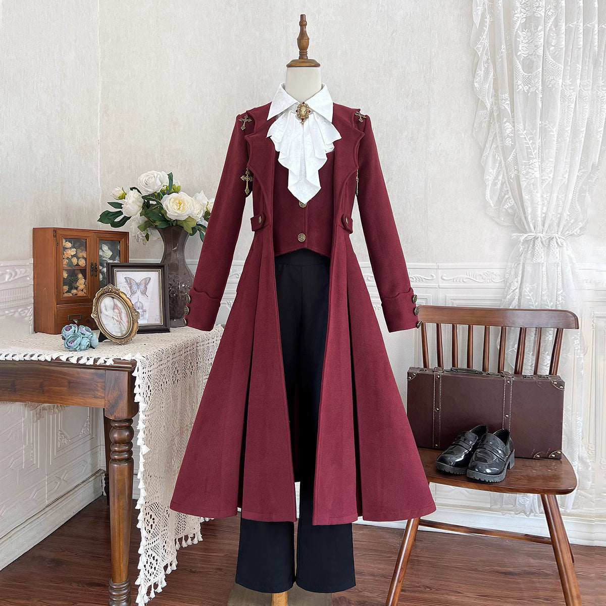 This dark crimson prince set draws inspiration from Gothic aristocracy and vampire lore, blending dramatic elegance with Ouji fashion's structured silhouettes. The tailored medieval coat features intricate gold detailing, velvet accents, and opulent brocade, evoking a haunting yet regal atmosphere. Paired with ruffled inner shirts and tailored trousers, the ensemble merges historical grandeur with Lolita aesthetics, perfect for creating captivating autumnal narratives of dark romance.
