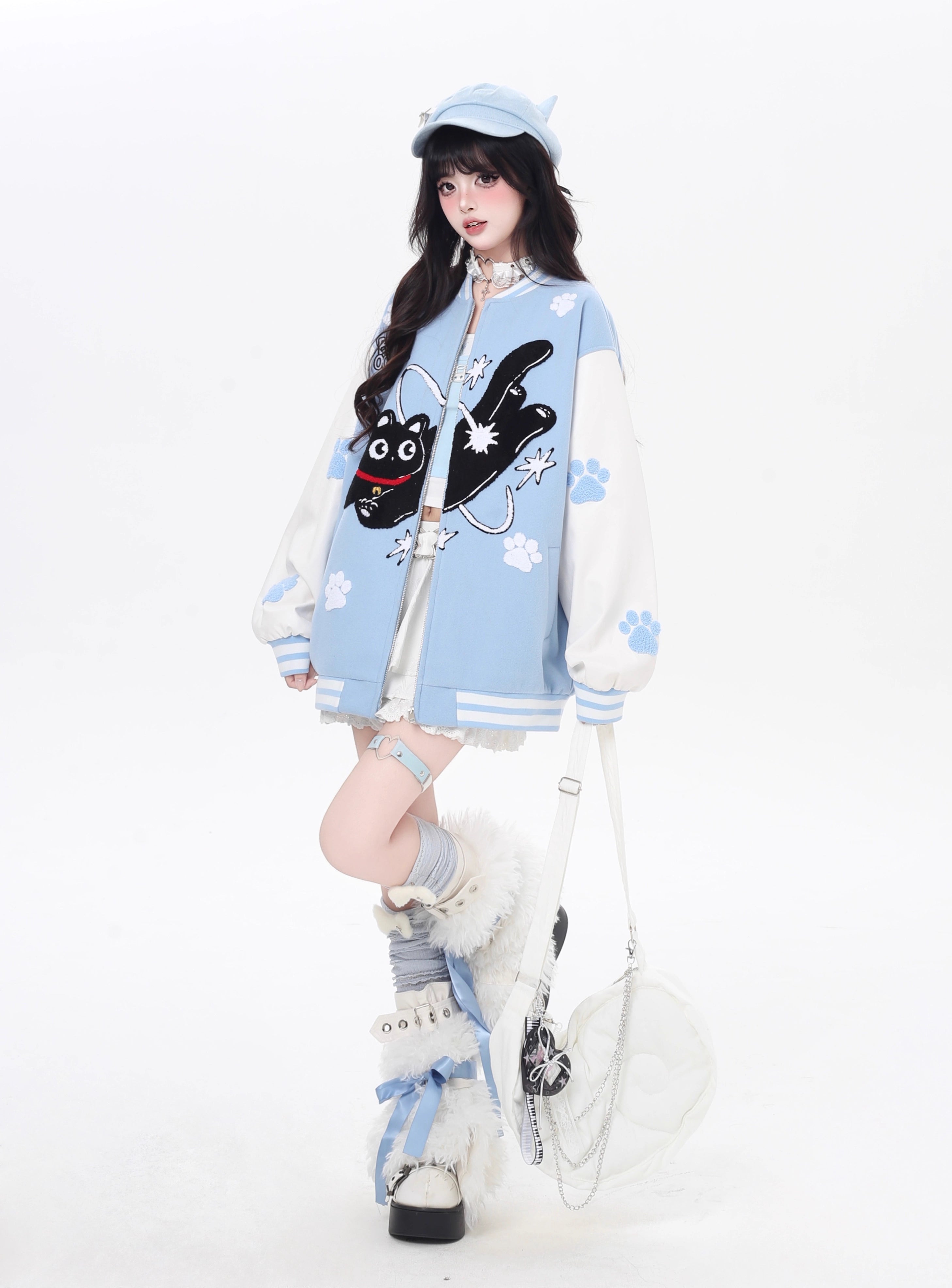 Inspired by cosmic curiosity and urban style, this baseball jacket combines celestial cat embroidery with bold color-blocking. The relaxed fit and soft fabric offer comfort with a rebellious edge, perfect for day-to-night versatility. A statement piece for those who love playful yet cool aesthetics.