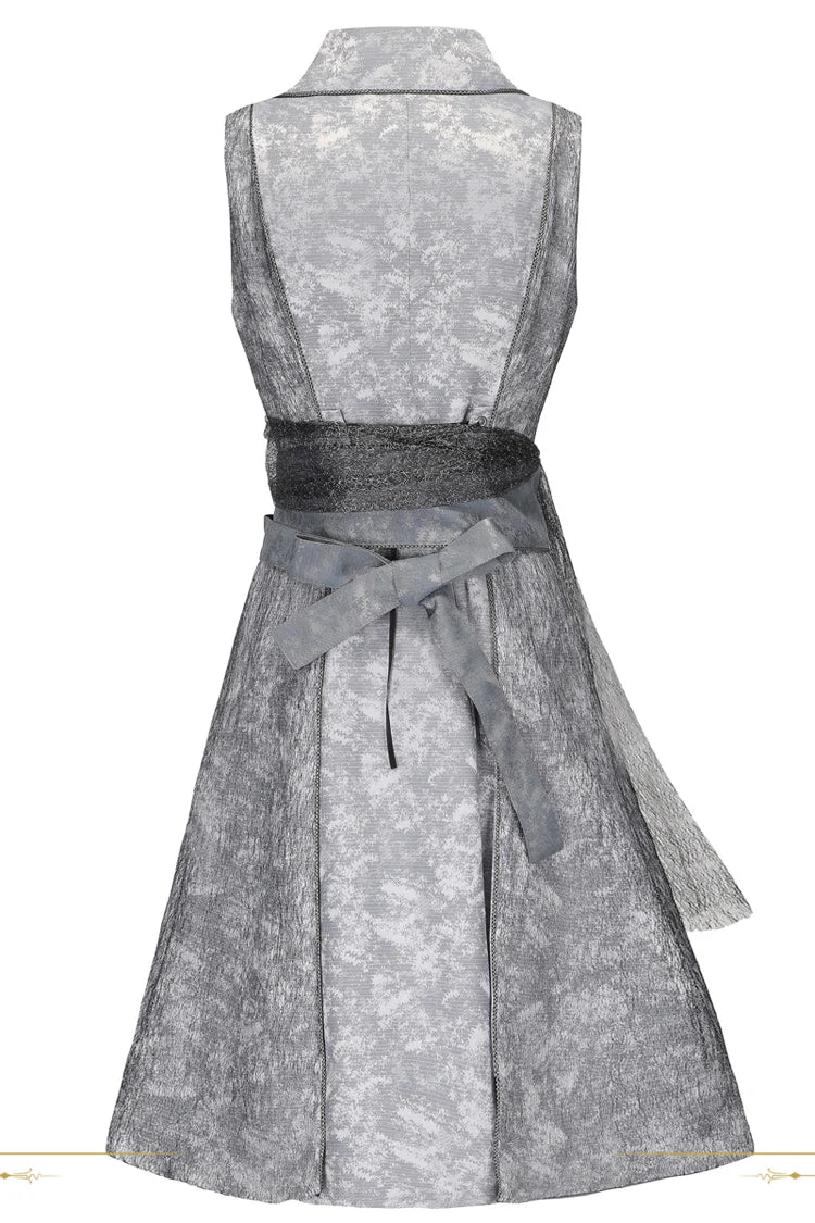 Inspired by the fusion of Victorian elegance and industrial steam-powered innovation, this coat reimagines aristocratic tailoring with avant-garde Lolita aesthetics. The sleeveless design emphasizes structured shoulders and a sharp silhouette, evoking the commanding presence of a fantasy prince. Details like faux gear motifs and metallic accents pay homage to steampunk craftsmanship, while the grey wool blend fabric bridges classic sophistication and futuristic charm.