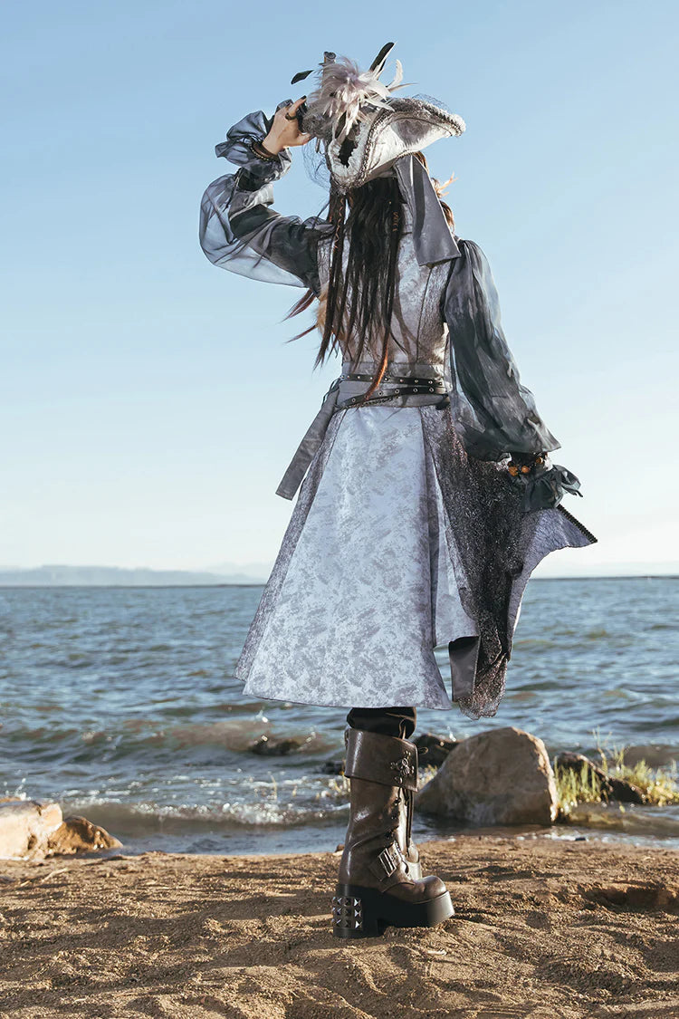 Inspired by the fusion of Victorian elegance and industrial steam-powered innovation, this coat reimagines aristocratic tailoring with avant-garde Lolita aesthetics. The sleeveless design emphasizes structured shoulders and a sharp silhouette, evoking the commanding presence of a fantasy prince. Details like faux gear motifs and metallic accents pay homage to steampunk craftsmanship, while the grey wool blend fabric bridges classic sophistication and futuristic charm.