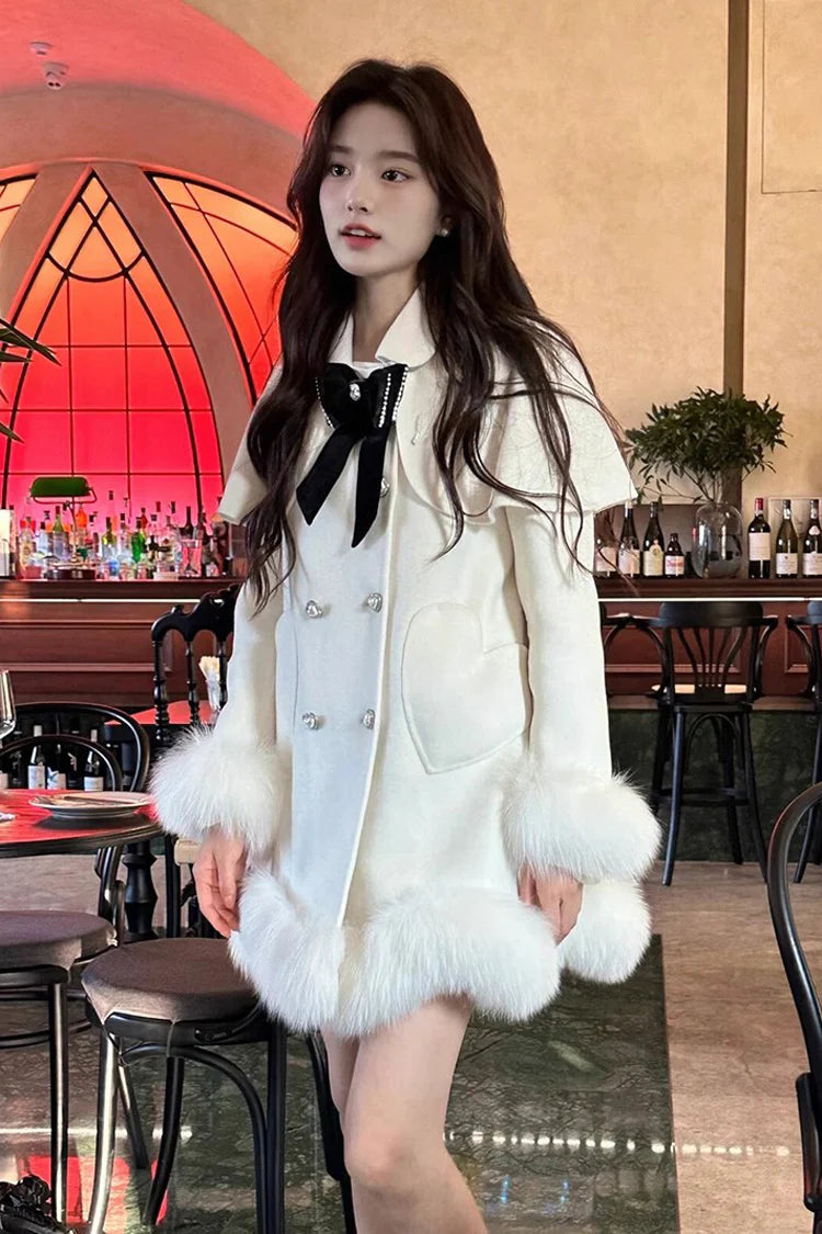 Blending whimsy with elegance, this cape coat transforms classic Lolita charm into a versatile outerwear piece. The playful rabbit ears and delicate bow contrast the monochrome palette, creating a striking balance between sweetness and sophistication. Designed with a flowing silhouette and single-row button closure, it offers effortless layering for cool days—perfect for adding a touch of fantasy to both casual and formal Lolita coordinates.