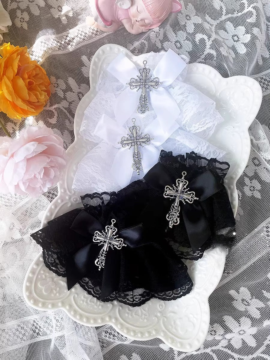Inspired by the sweet-gothic fusion in Lolita fashion, these arm sleeves blend sacred symbolism and playful elegance. Delicate lace, satin bows, and striking cross motifs create a balance of innocence and rebellion. The black-and-white palette enhances the classic  (sweet-edgy) aesthetic, perfect for adding a touch of devotional charm to Gothic Lolita coordinates or Y2K-inspired street style.