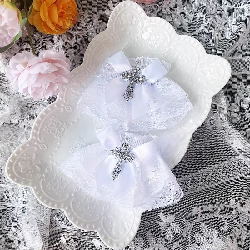 Inspired by the sweet-gothic fusion in Lolita fashion, these arm sleeves blend sacred symbolism and playful elegance. Delicate lace, satin bows, and striking cross motifs create a balance of innocence and rebellion. The black-and-white palette enhances the classic  (sweet-edgy) aesthetic, perfect for adding a touch of devotional charm to Gothic Lolita coordinates or Y2K-inspired street style.