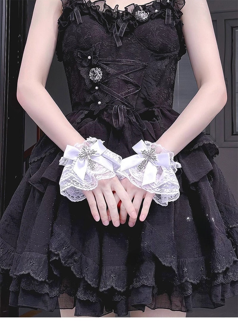 Inspired by the sweet-gothic fusion in Lolita fashion, these arm sleeves blend sacred symbolism and playful elegance. Delicate lace, satin bows, and striking cross motifs create a balance of innocence and rebellion. The black-and-white palette enhances the classic  (sweet-edgy) aesthetic, perfect for adding a touch of devotional charm to Gothic Lolita coordinates or Y2K-inspired street style.