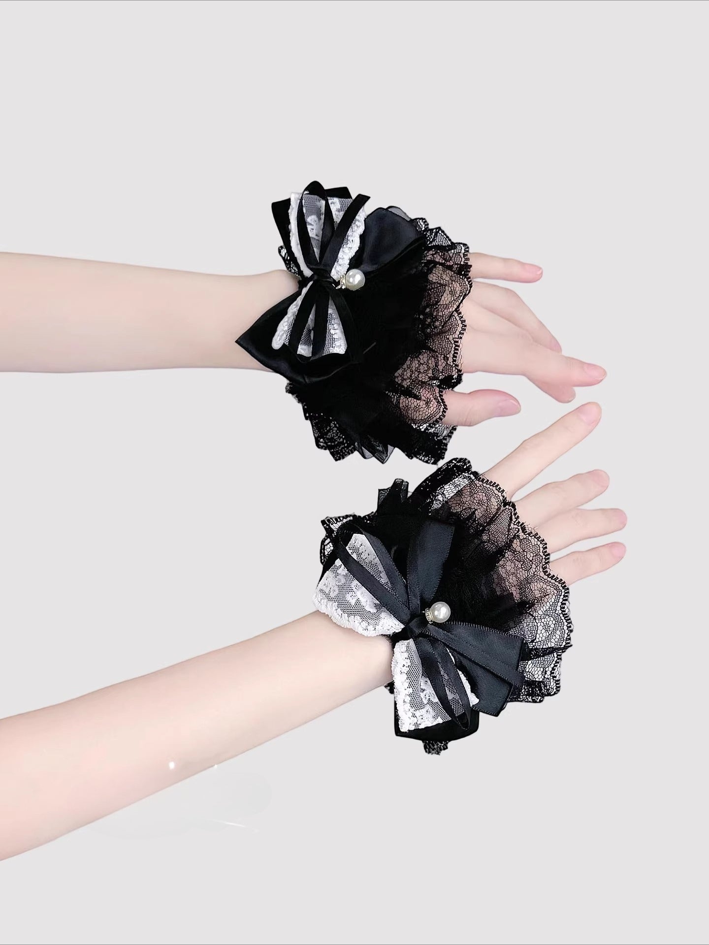 Inspired by the delicate elegance of Lolita fashion, these wrist cuffs blend fantasy and femininity. Adorned with intricate lace, dainty pearls, and a charming bow accent, they embody romantic innocence. Crafted from soft materials for all-day comfort, they offer a subtle yet enchanting touch to JK uniforms or Lolita coordinates, perfect for expressing timeless sweetness and grace.