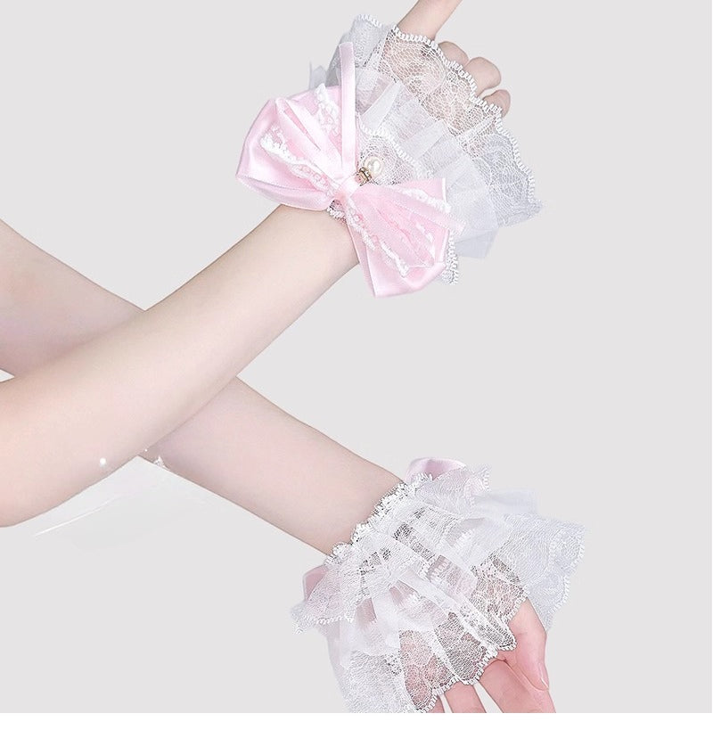 Inspired by the delicate elegance of Lolita fashion, these wrist cuffs blend fantasy and femininity. Adorned with intricate lace, dainty pearls, and a charming bow accent, they embody romantic innocence. Crafted from soft materials for all-day comfort, they offer a subtle yet enchanting touch to JK uniforms or Lolita coordinates, perfect for expressing timeless sweetness and grace.