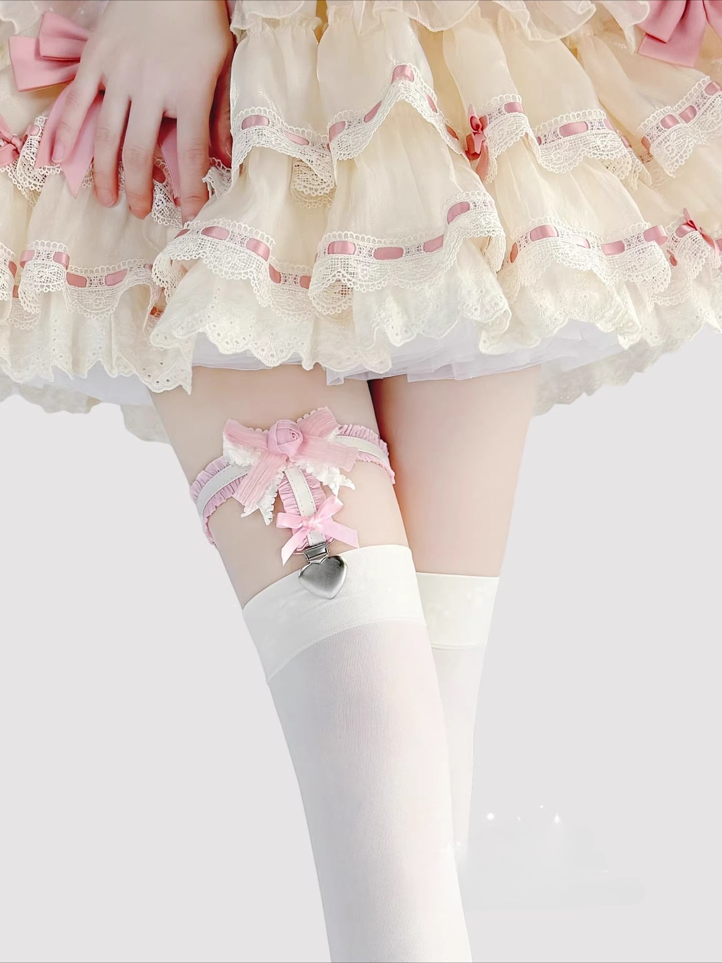 Inspired by the delicate details of Lolita fashion, this garter combines fantasy and function. Soft elastic fabric adorned with intricate lace, a dainty rose, and a satin bow creates a romantic yet playful accessory. The adjustable design and anti-slip grip ensure comfort and security, perfect for adding a touch of whimsical elegance to Lolita coordinates, cosplay outfits, or vintage-inspired ensembles.