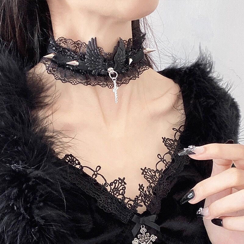 This Lolita Cyberpunk Gothic Choker Necklace fuses edgy punk style with vintage Lolita elegance. Designed with delicate lace, bold studs, and angel wing accents, it creates a striking balance of softness and rebellion. Available in classic black and white, it is a versatile accessory to match both sweet and dark Lolita outfits. Perfect for parties, photoshoots, or themed events, this choker adds a unique cyber-gothic touch to any ensemble.