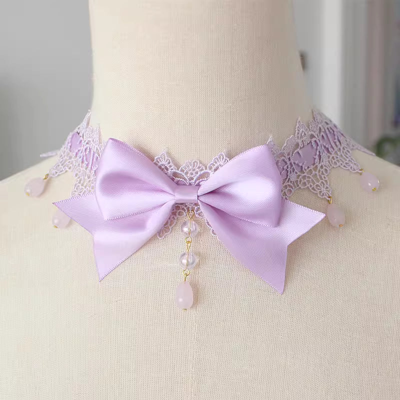 This Lolita Lace Bowknot Pearl Choker Necklace is designed as a versatile accessory to elevate any Lolita look. Featuring delicate lace, dainty pearls, and a sweet bowknot centerpiece, it strikes a balance between elegance and cuteness. The soft yet ornate design makes it perfect for pairing with dresses, from sweet styles to gothic ensembles. Ideal for tea parties, photoshoots, or daily styling, this choker adds a refined touch of Lolita charm.