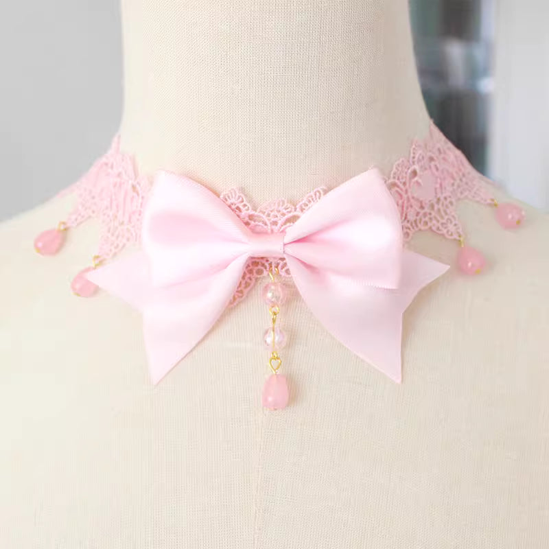 This Lolita Lace Bowknot Pearl Choker Necklace is designed as a versatile accessory to elevate any Lolita look. Featuring delicate lace, dainty pearls, and a sweet bowknot centerpiece, it strikes a balance between elegance and cuteness. The soft yet ornate design makes it perfect for pairing with dresses, from sweet styles to gothic ensembles. Ideal for tea parties, photoshoots, or daily styling, this choker adds a refined touch of Lolita charm.