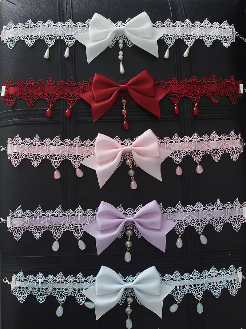 This Lolita Lace Bowknot Pearl Choker Necklace is designed as a versatile accessory to elevate any Lolita look. Featuring delicate lace, dainty pearls, and a sweet bowknot centerpiece, it strikes a balance between elegance and cuteness. The soft yet ornate design makes it perfect for pairing with dresses, from sweet styles to gothic ensembles. Ideal for tea parties, photoshoots, or daily styling, this choker adds a refined touch of Lolita charm.