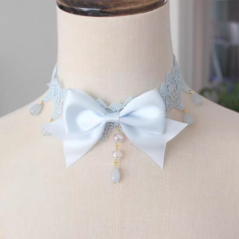 This Lolita Lace Bowknot Pearl Choker Necklace is designed as a versatile accessory to elevate any Lolita look. Featuring delicate lace, dainty pearls, and a sweet bowknot centerpiece, it strikes a balance between elegance and cuteness. The soft yet ornate design makes it perfect for pairing with dresses, from sweet styles to gothic ensembles. Ideal for tea parties, photoshoots, or daily styling, this choker adds a refined touch of Lolita charm.