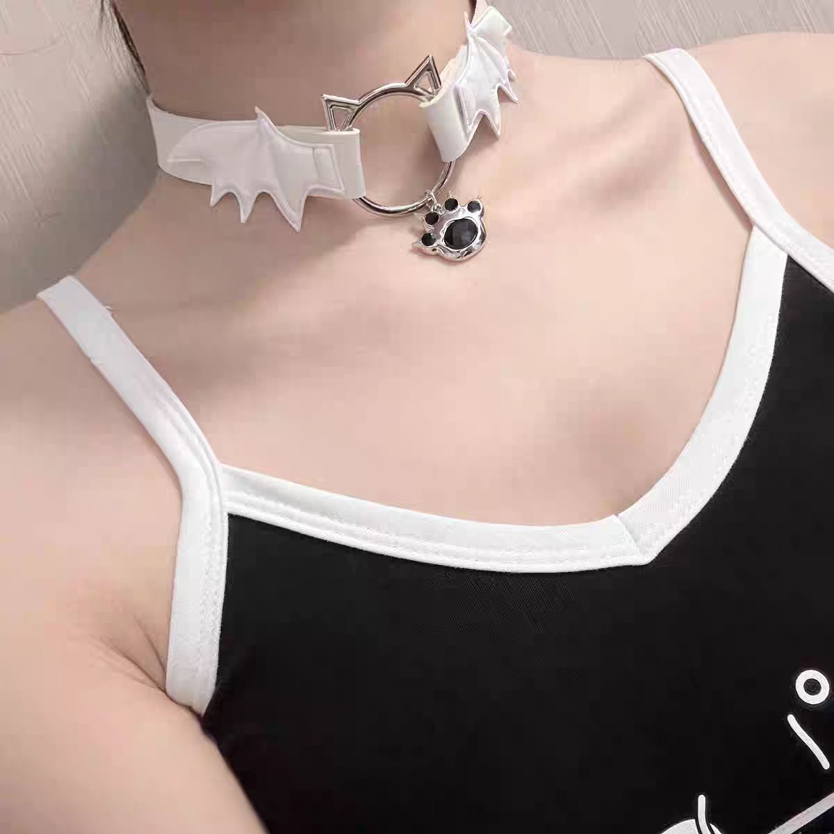This Lolita Punk Cat Claw Leather Choker Necklace brings an edgy subcultural flair to Lolita fashion. Crafted in sleek leather with bold cat claw accents, it balances rebellion with playful detail. Available in both black and white, it suits different moods and styling needs. Perfect for gothic, punk, or alternative Lolita outfits, this choker adds a fierce yet stylish touch, making it an eye-catching accessory for parties, cosplay, or themed gatherings.