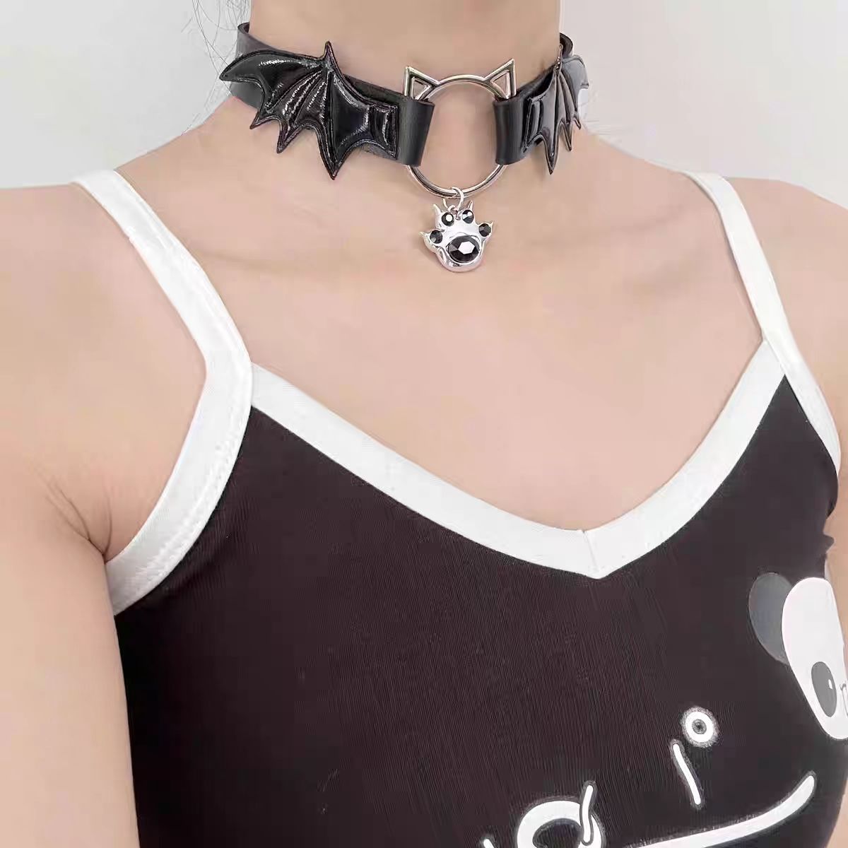 This Lolita Punk Cat Claw Leather Choker Necklace brings an edgy subcultural flair to Lolita fashion. Crafted in sleek leather with bold cat claw accents, it balances rebellion with playful detail. Available in both black and white, it suits different moods and styling needs. Perfect for gothic, punk, or alternative Lolita outfits, this choker adds a fierce yet stylish touch, making it an eye-catching accessory for parties, cosplay, or themed gatherings.