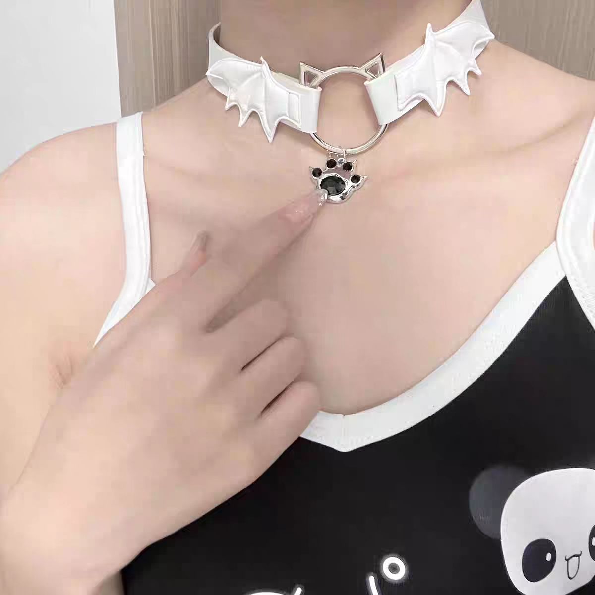 This Lolita Punk Cat Claw Leather Choker Necklace brings an edgy subcultural flair to Lolita fashion. Crafted in sleek leather with bold cat claw accents, it balances rebellion with playful detail. Available in both black and white, it suits different moods and styling needs. Perfect for gothic, punk, or alternative Lolita outfits, this choker adds a fierce yet stylish touch, making it an eye-catching accessory for parties, cosplay, or themed gatherings.