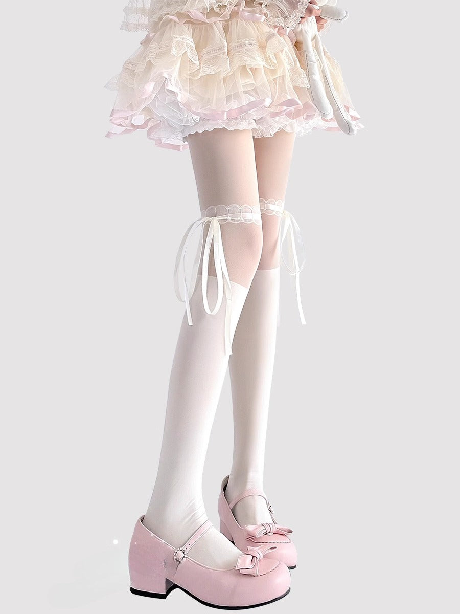 These Lolita-style tights are crafted in classic black and ivory, featuring delicate lace trims and charming bow accents. The sheer, ballet-inspired design adds a soft, elegant touch to any outfit, perfectly complementing Sweet Lolita dresses and skirts. Comfortable and lightweight, they are ideal for daily wear, tea parties, or special Lolita gatherings, enhancing the overall princess-like aesthetic of your ensemble.