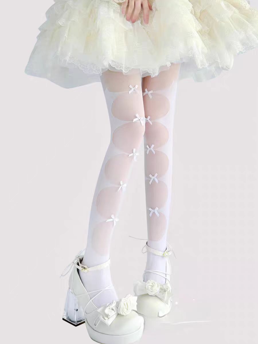Inspired by the delicate charm of Lolita fashion, these cream-colored tights blend elegance with practicality. Featuring a subtle bow detail and ultra-sheer lightweight fabric, they offer a perfect summer layering piece. The snag-resistant construction ensures durability, while the soft cream hue adds a touch of romantic innocence to any Lolita coordinate. Designed for both beauty and everyday wear.