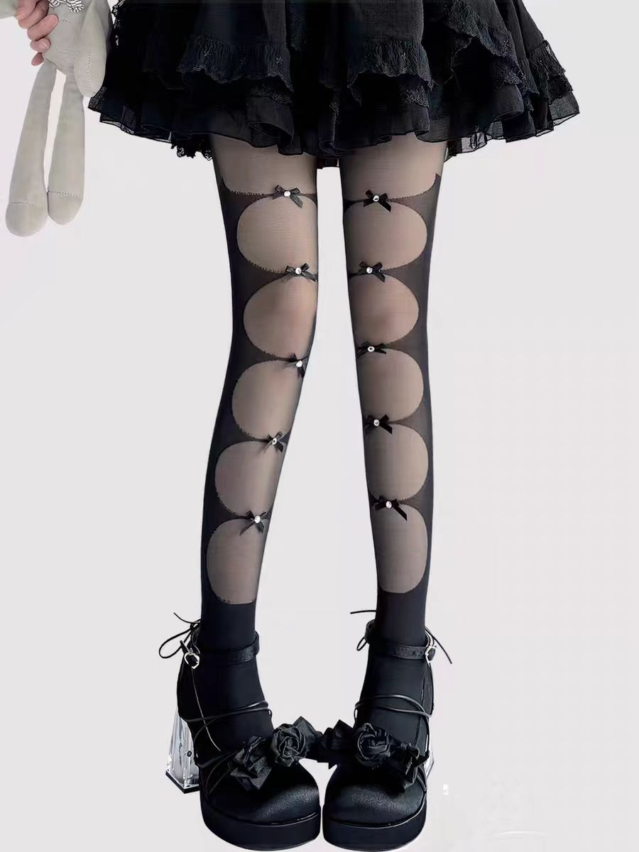 Inspired by the delicate charm of Lolita fashion, these cream-colored tights blend elegance with practicality. Featuring a subtle bow detail and ultra-sheer lightweight fabric, they offer a perfect summer layering piece. The snag-resistant construction ensures durability, while the soft cream hue adds a touch of romantic innocence to any Lolita coordinate. Designed for both beauty and everyday wear.