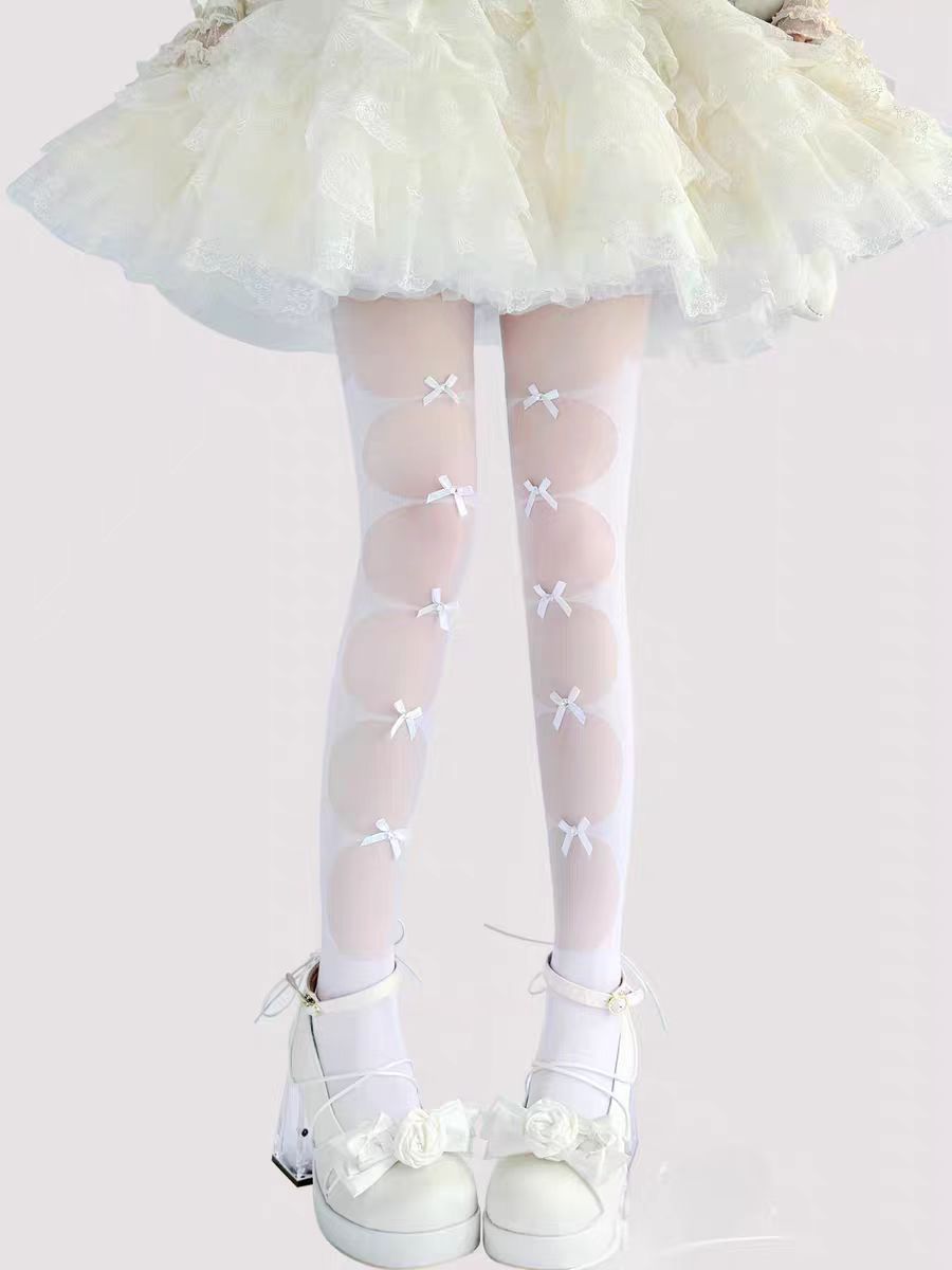 Inspired by the delicate charm of Lolita fashion, these cream-colored tights blend elegance with practicality. Featuring a subtle bow detail and ultra-sheer lightweight fabric, they offer a perfect summer layering piece. The snag-resistant construction ensures durability, while the soft cream hue adds a touch of romantic innocence to any Lolita coordinate. Designed for both beauty and everyday wear.