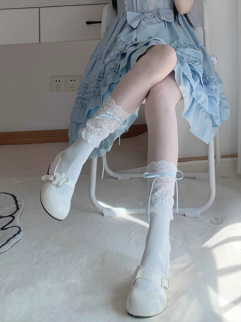 Inspired by Harajuku street style, these socks blend delicate lace trim with playful Lolita charm. The soft white fabric and elegant ribbon ties create a sweet, romantic aesthetic, perfect for adding a touch of kawaii elegance to any outfit. Designed for comfort and whimsy, they capture the essence of Japanese youth culture with timeless innocence.