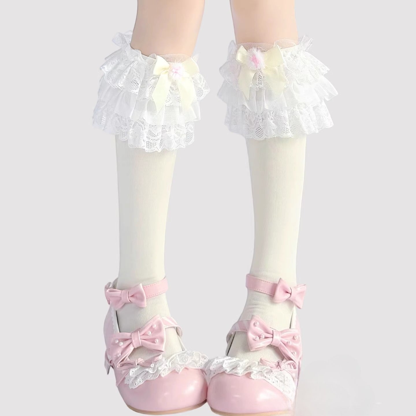 Step into a world of sweet elegance with these multi-color Lolita knee-high socks. Crafted from soft, breathable cotton, each pair features delicate lace trim along the top and charming bow accents, adding a playful yet refined touch to your outfit. Perfect for pairing with Lolita dresses, skirts, or school-style JK ensembles, these socks bring a cute and whimsical element to daily wear, tea parties, or special gatherings. Comfortable and versatile, they are an essential accessory for any Lolita fashion ent