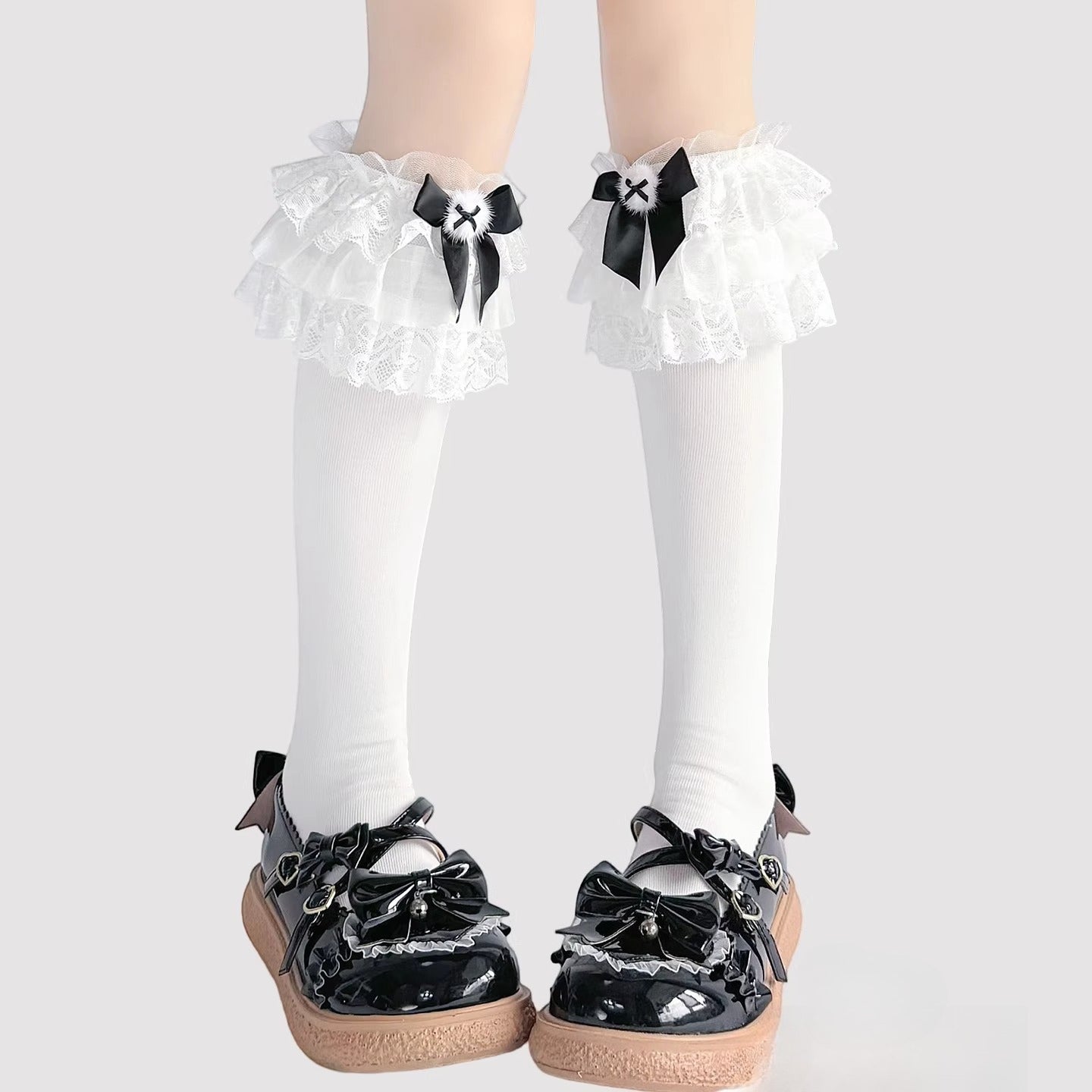 Step into a world of sweet elegance with these multi-color Lolita knee-high socks. Crafted from soft, breathable cotton, each pair features delicate lace trim along the top and charming bow accents, adding a playful yet refined touch to your outfit. Perfect for pairing with Lolita dresses, skirts, or school-style JK ensembles, these socks bring a cute and whimsical element to daily wear, tea parties, or special gatherings. Comfortable and versatile, they are an essential accessory for any Lolita fashion ent
