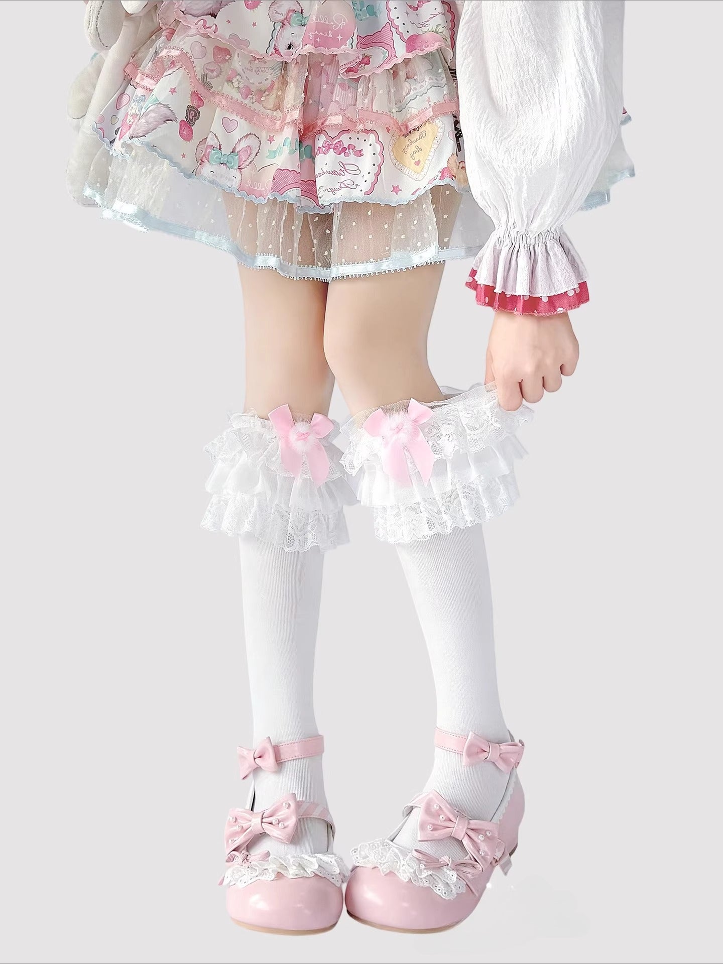 Step into a world of sweet elegance with these multi-color Lolita knee-high socks. Crafted from soft, breathable cotton, each pair features delicate lace trim along the top and charming bow accents, adding a playful yet refined touch to your outfit. Perfect for pairing with Lolita dresses, skirts, or school-style JK ensembles, these socks bring a cute and whimsical element to daily wear, tea parties, or special gatherings. Comfortable and versatile, they are an essential accessory for any Lolita fashion ent