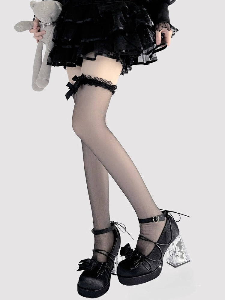 Design Concept:
These Lolita-style over-the-knee stockings are crafted in sheer black and white fabric, featuring delicate bow accents at the top for a playful yet elegant touch. The semi-transparent material adds a subtle allure while maintaining a sweet Lolita aesthetic, making them perfect for daily wear, tea parties, or special occasions. The soft stretch ensures a comfortable fit that stays in place all day.