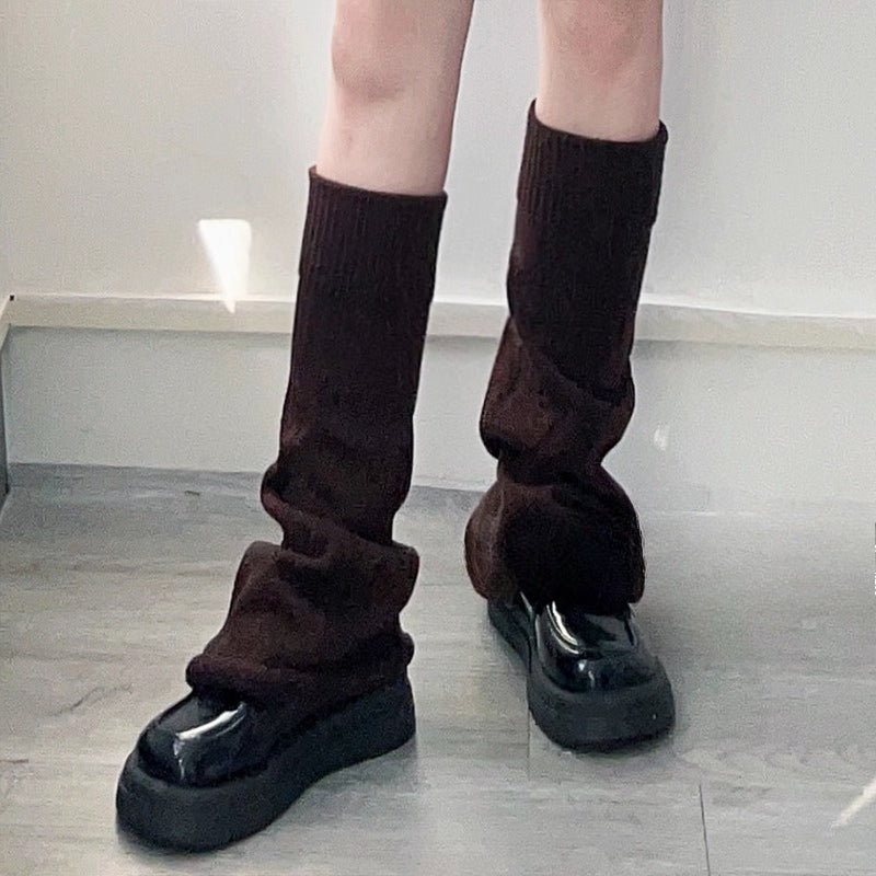 Inspired by the bold fusion of Y2K aesthetics and Japanese street style, these flared leg warmers redefine cozy fashion. The bell-shaped design and soft knit fabric combine retro glamour with Lolita sweetness, while the stacked mid-calf fit offers both warmth and a striking silhouette. Perfect for adding a playful yet edgy statement to any outfit, blending millennial nostalgia with contemporary cuteness.