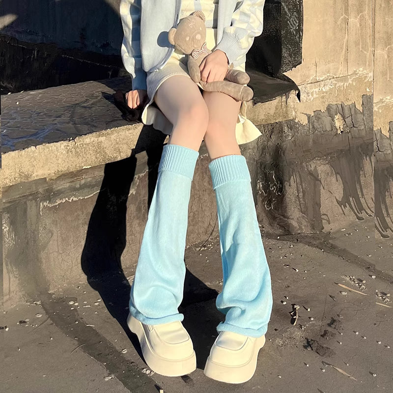 Inspired by the bold fusion of Y2K aesthetics and Japanese street style, these flared leg warmers redefine cozy fashion. The bell-shaped design and soft knit fabric combine retro glamour with Lolita sweetness, while the stacked mid-calf fit offers both warmth and a striking silhouette. Perfect for adding a playful yet edgy statement to any outfit, blending millennial nostalgia with contemporary cuteness.