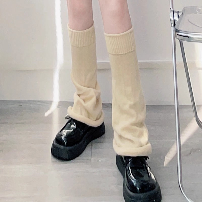 Inspired by the bold fusion of Y2K aesthetics and Japanese street style, these flared leg warmers redefine cozy fashion. The bell-shaped design and soft knit fabric combine retro glamour with Lolita sweetness, while the stacked mid-calf fit offers both warmth and a striking silhouette. Perfect for adding a playful yet edgy statement to any outfit, blending millennial nostalgia with contemporary cuteness.