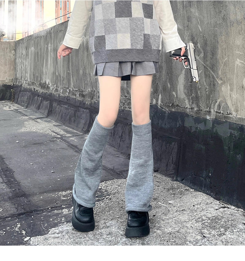 Inspired by the bold fusion of Y2K aesthetics and Japanese street style, these flared leg warmers redefine cozy fashion. The bell-shaped design and soft knit fabric combine retro glamour with Lolita sweetness, while the stacked mid-calf fit offers both warmth and a striking silhouette. Perfect for adding a playful yet edgy statement to any outfit, blending millennial nostalgia with contemporary cuteness.